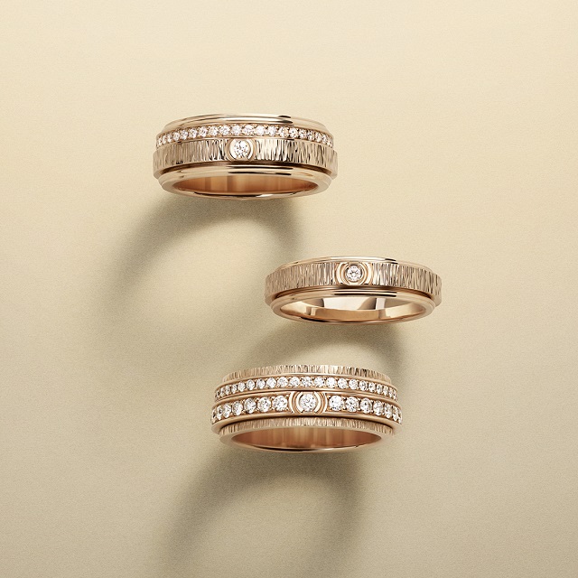 Three golden rings encrusted with diamonds