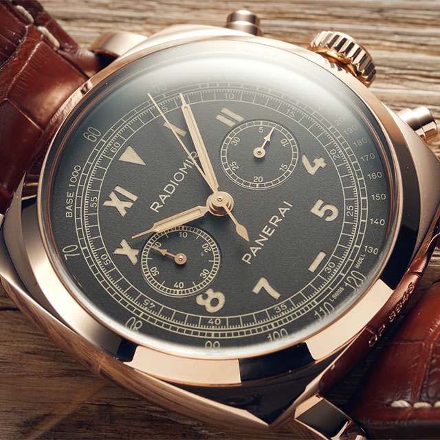 A close up of a watch with a brown leather strap