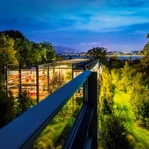 A view on the headquarters of Richemont in Bellevue, Geneva, Switzerland, in the evening with a view on the lake of Geneva