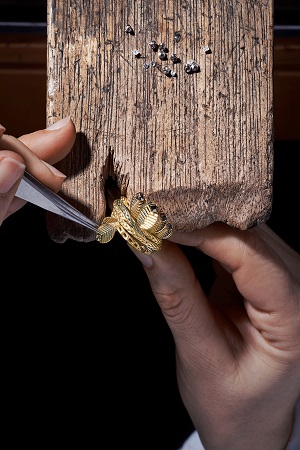 A person working on a jewellery piece